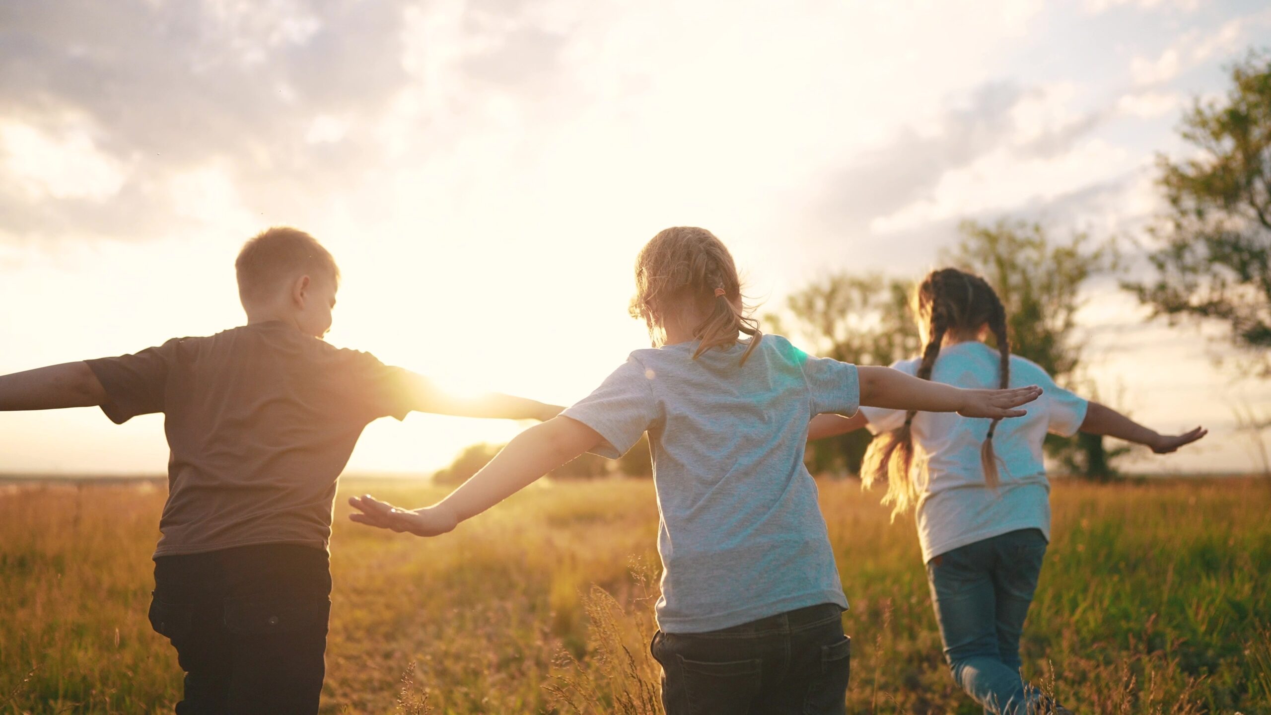 Kids,Run,In,The,Park,At,Sunset.,Happy,Family,Children